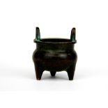 A miniature 19th / early 20th century Chinese bronze censer, H. 5.5cm.