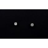 A pair of 18ct white gold (stamped 18k) stud earrings set with brilliant cut diamonds, approx. 0.