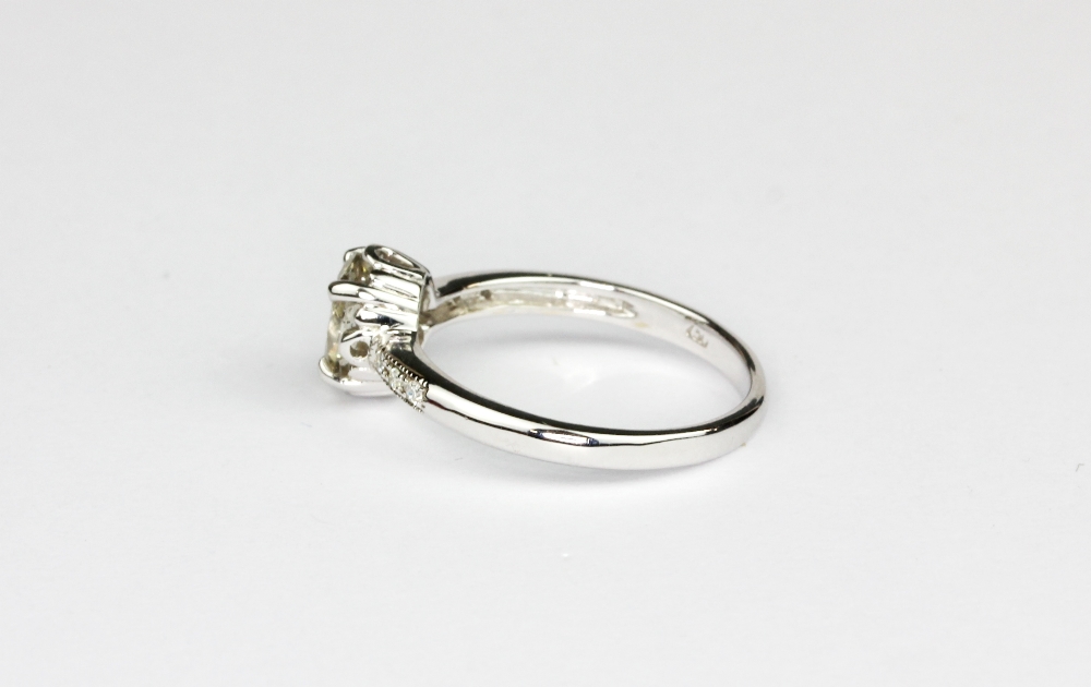 An 18ct white gold (worn stamp 750) ring set with an oval cut brilliant cut diamond and diamond - Image 2 of 2