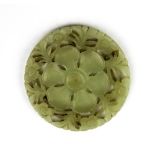 A 19th / early 20th century Chinese carved double sided nephrite jade flower panel, Dia. 5.5cm.