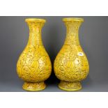 An impressive pair of Chinese relief decorated porcelain vases, H. 43cm.