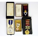 A silver gilt Masonic medal together with a further silver medal and two others.