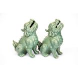 An unusual pair of Chinese celadon glazed porcelain lion dog figures, H. 19cm.