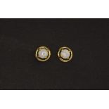 A pair of 18ct yellow gold (stamped 750) opal set stud earrings.