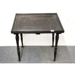 A 19th / early 20th century southern Indian / Sinhalese carved ebony tea table, 64 x 50 x 65cm.