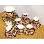 A very extensive Royal Crown Derby tea set, including 11 cups and saucers, 12 side plates, two