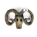 A Chinese patinated bronze goat's skull and horns, W. 14cm.