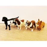 A group of four Beswick figures of dogs, tallest H. 8cm.