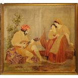 A large 19th Century woollen tapestry of two women admiring a lute player, frame size 149 x 133cm.