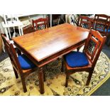 An Indian hardwood and wrought iron dining table and four chairs, 150 x 90cm.