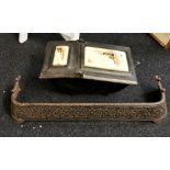 A continental cast iron, coal scuttle and a cast iron fender, coal scuttle 50 x 30 x 28cm. Fender W.