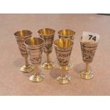 A set of six white metal niello decorated and gilt lined Kiddish cups, H. 8cm.