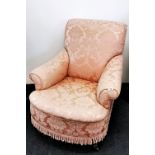 An early 20th Century Howard style upholstered arm chair, W. 85cm. H. 90cm.