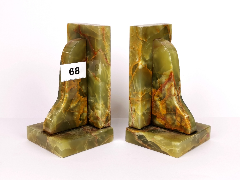 A pair of Art Deco onyx book ends, H. 15cm.