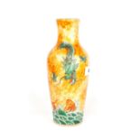 An unusual Chinese lusterware porcelain vase depicting a dragon in fiery clouds above a fish among