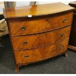 An early 19th Century mahogany veneered and cross banded bow front and three drawer chest, 91 x 47 x