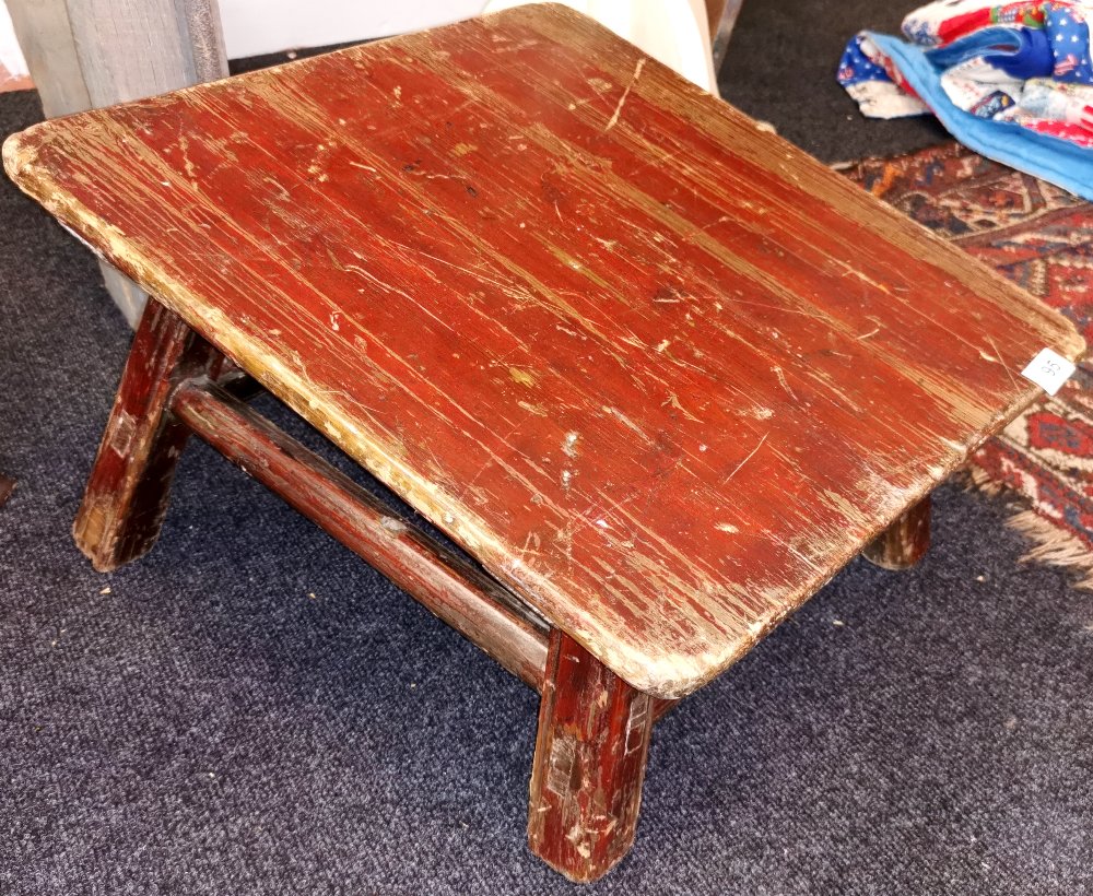 A 19th / early 20th Century Sino - Tibetan lacquered pine temple kneeler, 49 x 51cm. Highest point