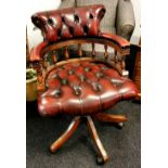 A leather button upholstered mahogany swivel captains chairs (A/F).