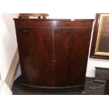 A Georgian mahogany two drawer bow front cabinet, W. 94cm H. 106cm.