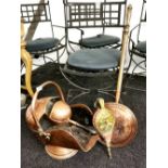 A Victorian copper coal scuttle and shovel with a copper warming pan and hammered brass and wood