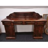 An early to Mid 19th Century mahogany and mahogany veneered buffet sideboard, W 168cm. H 114cm.