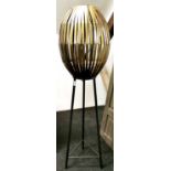 A contemporary gilt metal black tubular standard lamp, Hm 139cm.