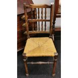 An 18th Century rush seat hall chair, H. 94cm.