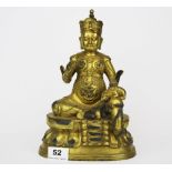 A Tibetan gilt bronze figure of a seated Buddhist Deity, H. 26cm.