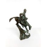 A Remington style cast bronze figure of a horse and rider slightly A/F, H. 27cm.