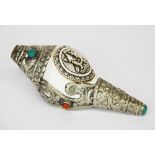 A Tibetan white metal mounted conch shell horn, L. 15cm.