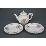 A Royal Worcester 'Roanoke' pattern teapot and two tea plates.