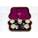 A lovely cased presentation mustard and salt set with two hallmarked silver spoons and three