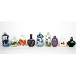 A group of nine Chinese porcelain snuff bottles, tallest 9cm.
