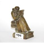 A very interesting small cubist bronze figure of a man reading seated on a pile of books, H, 12.