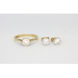 A 9ct yellow gold stone set solitaire ring, (J).