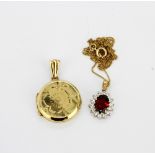 A 9ct yellow gold garnet and white stone set cluster pendant and chain together with a 9ct yellow