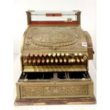 An early heavy bronze/brass national shop cash register, 47cm x 41cm x 46cm. Missing marble plate.