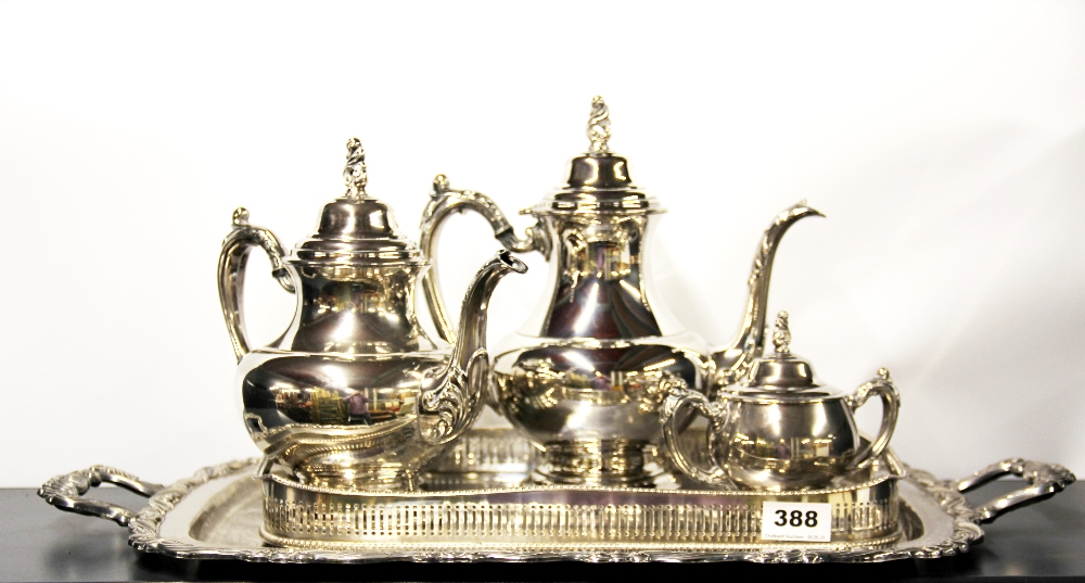 Two silver plated trays and a silver plated tea set.