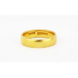 A 22ct yellow gold wedding band, (O).