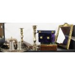 A group of silver plate and brass items.