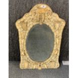 A superb mid-19th Century Dieppe carved ivory and bone framed mirror, H. 82cm. W. 50cm.