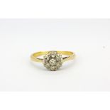 An18ct yellow gold (stamped 18ct) diamond set cluster ring, (K).