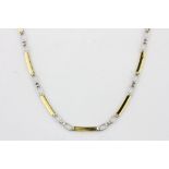 An 18ct yellow and white gold (stamped 750) necklace, L. 42cm.