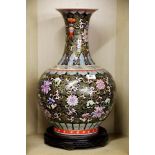 An impressive 19th / early 20th century Chinese porcelain vase with famille noire decoration and a