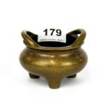 A small Chinese cast bronze censer, H. 6cm. Dia. 9cm.