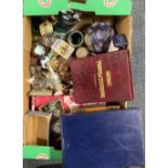 A box of mixed interesting items including cigarette cards and other items.