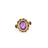 A 9ct yellow gold oval cut amethyst set ring, (K).