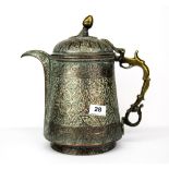 Islamic interest: A 19th Century Persian hammered copper and brass coffee pot, H. 30cm.