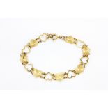 A 9ct yellow gold (stamped 9ct) heart bracelet, L. 19cm.