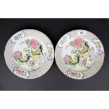 A pair of Chinese hand enamelled porcelain plates, Dia. 23cm.